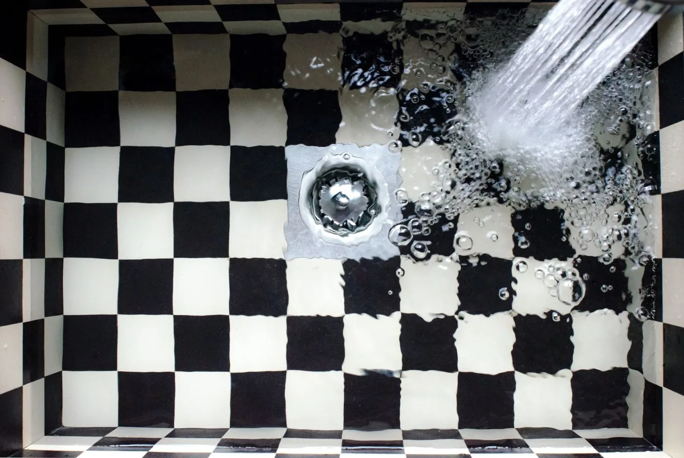 Plumbing work under a kitchen sink
